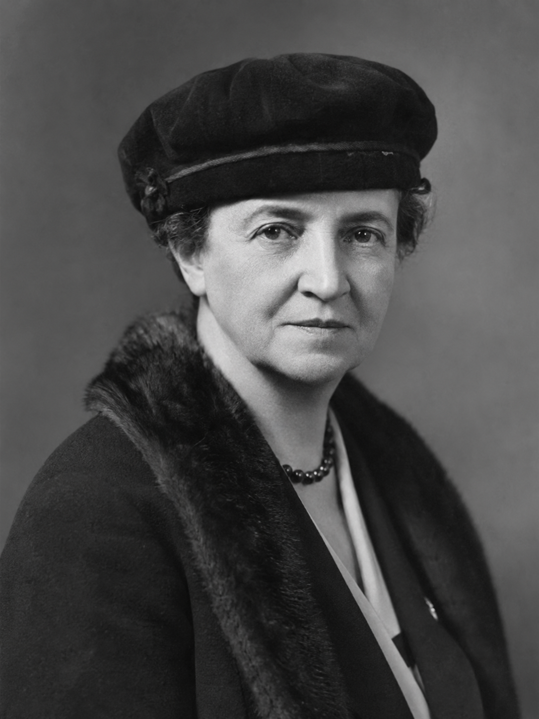 Frances Perkins, United States Secretary of Labor under President Franklin Roosevelt, formal portrait in 1930s era clothing, the first woman to serve in a US presidential cabinet, champion of American labor reform