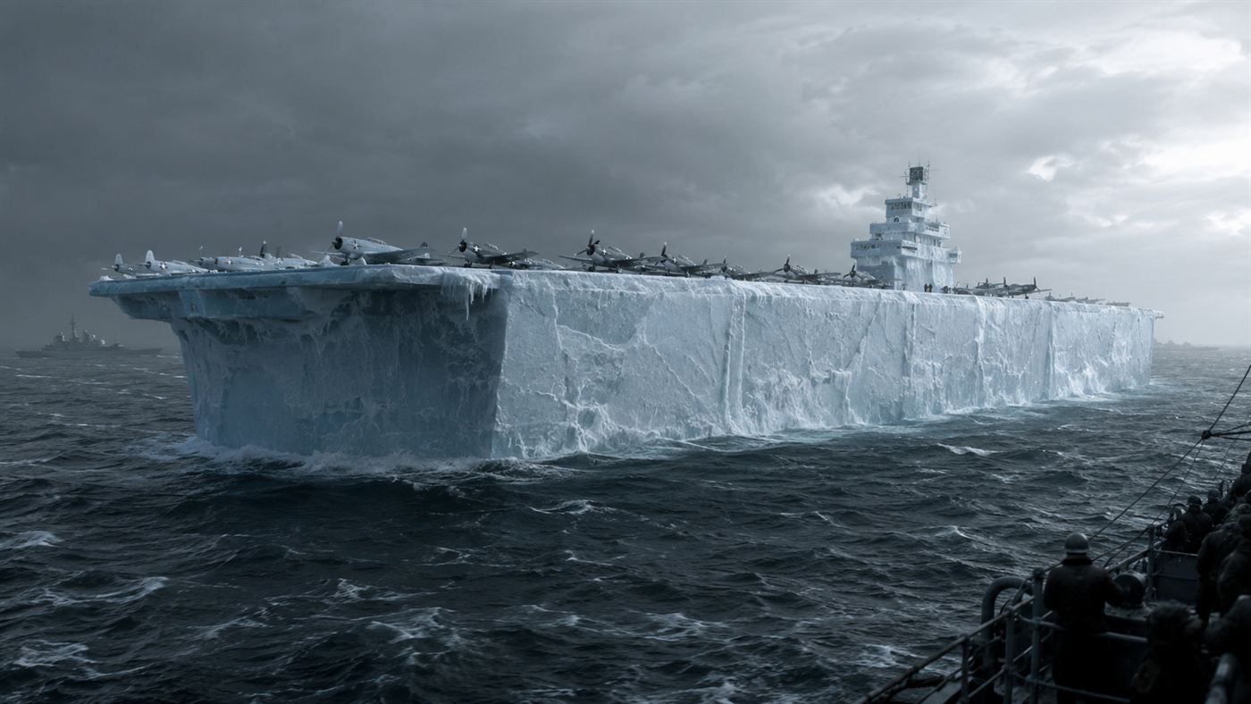 Project Habakkuk: a huge slab-sided aircraft carrier made of ice floating in a grey wartime sea with planes on its deck