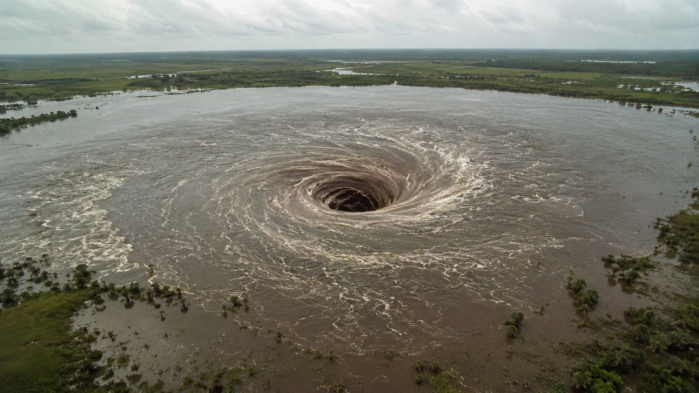 Lake Peigneur whirlpool disaster in Louisiana in 1980 with a massive vortex visible at the surface of the shallow lake