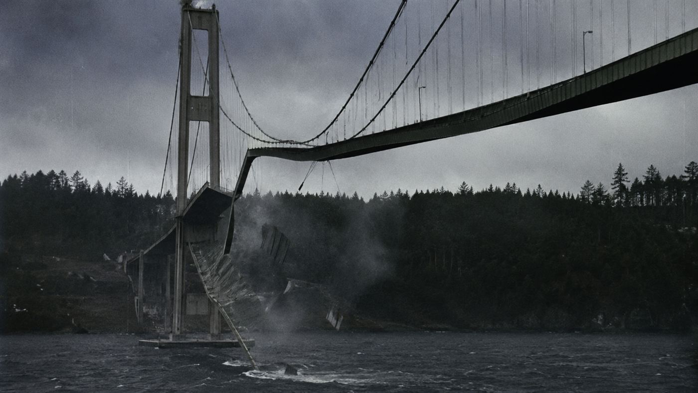 The Tacoma Narrows Bridge twisting violently in 42-mile-per-hour winds over Puget Sound on the morning of November 7, 1940